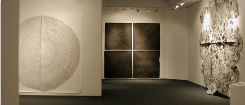 Interior of the Visual Arts Gallery featuring large abstract artwork on the walls