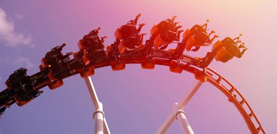 People riding a roller coaster People riding a roller coaster