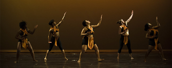 Dancers in amber light