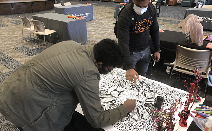 SHCMA students coloring at  Fall 2021 Homecoming event