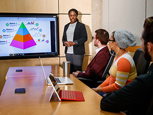 Business student giving presentation to other students Business student giving presentation to other students