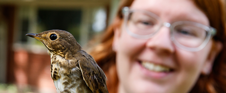 Student holding bird