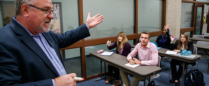 Professor asking question to students