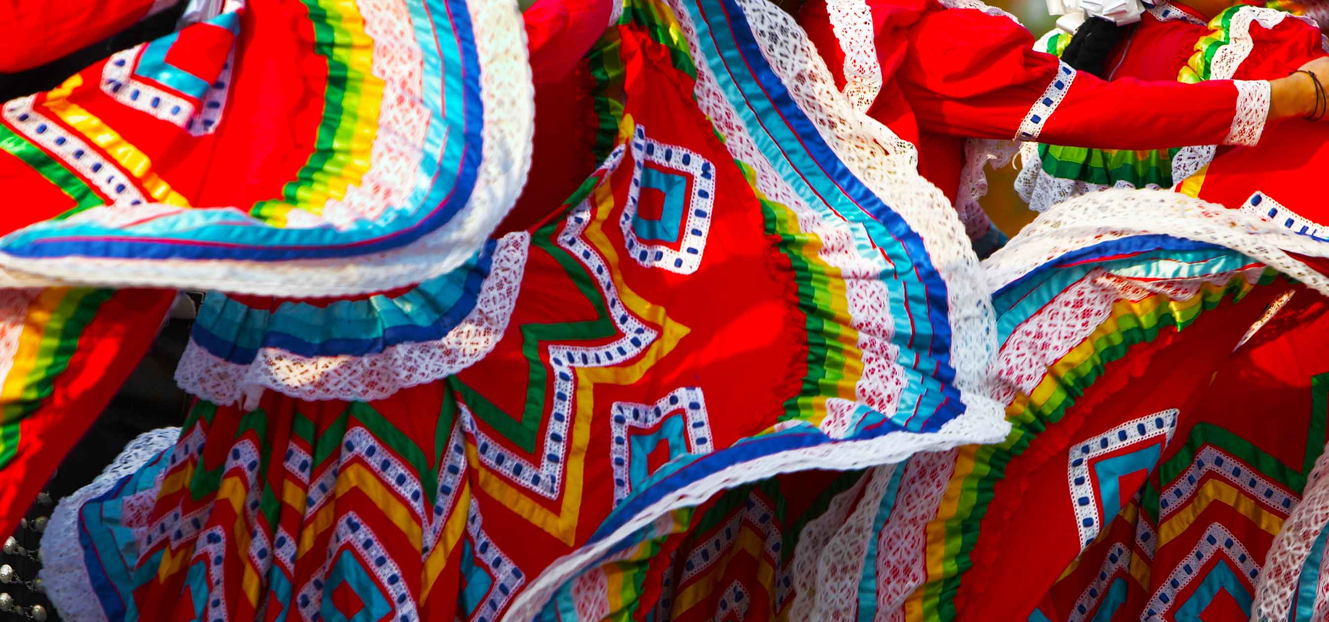Mexican folk dancers twirling their dress